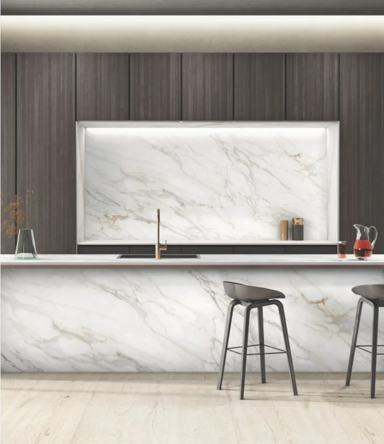 Aurelia Carrara tiles across a marble-look kitchen island and backsplash